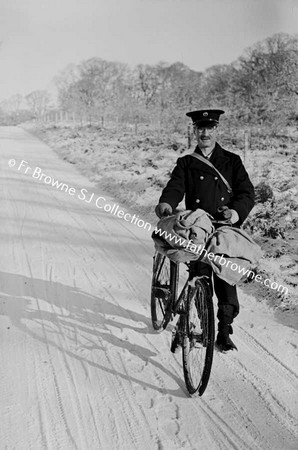 SNOW SCENE  KIERAN RIGNEY POSTMAN ON BICYCLE